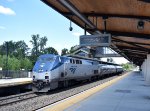 Southbound Amtrak Shuttle Train # 463 departs the depot with P42 # 97 on the point